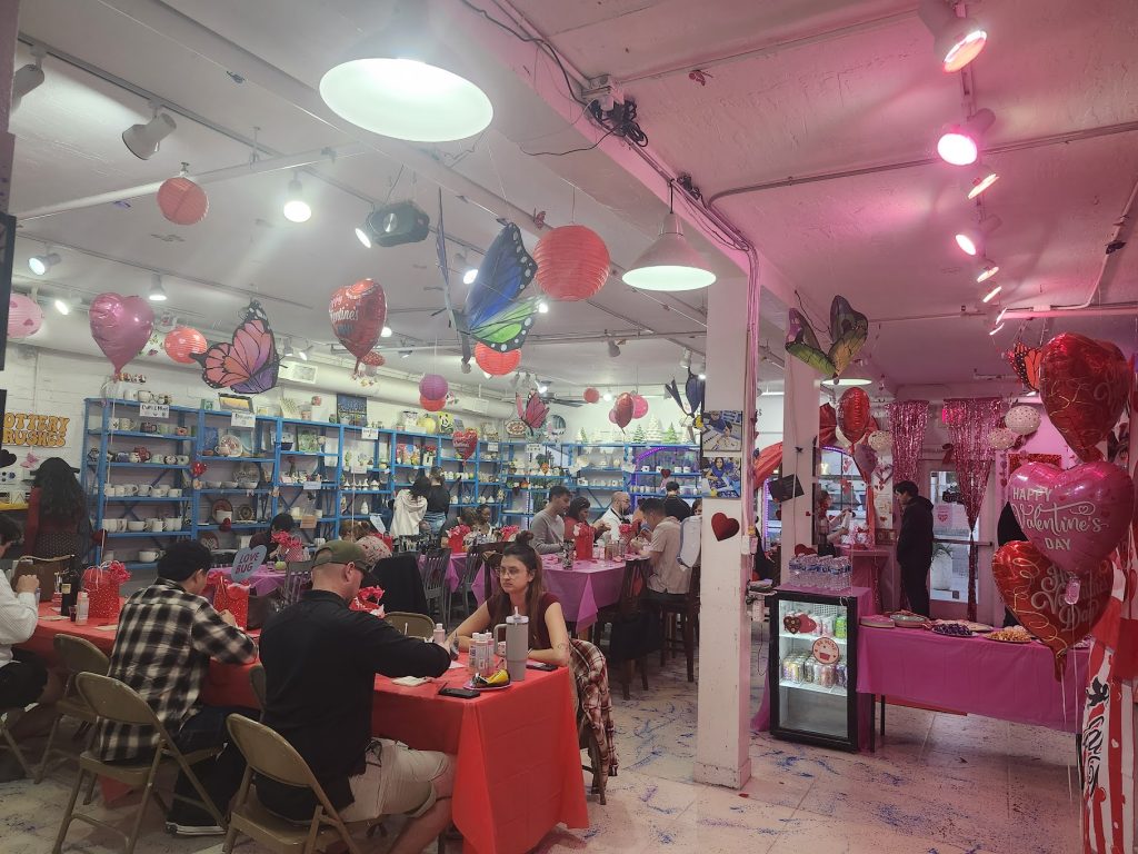 Guests enjoying painting, connecting with each other, and all around great vibes at our Valentine Bash 2026 in Chandler