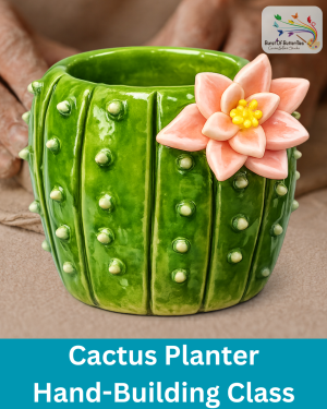 Glossy green cactus planter with textured bumps and pink flower made in clay hand-building class at Burst of Butterflies in Arizona