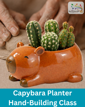 Hand-built clay capybara planter with glossy brown glaze holding small cactus plants at Burst of Butterflies Chandler